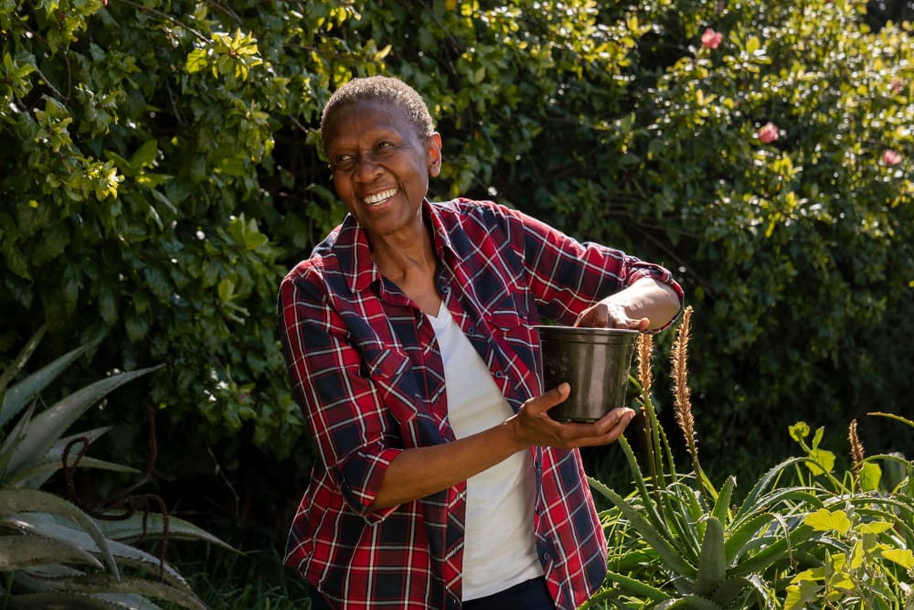 A smiling woman building self-reliance through livelihood support