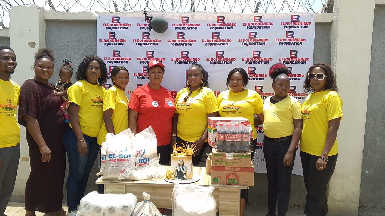 Foundation team members standing together beside donated supplies